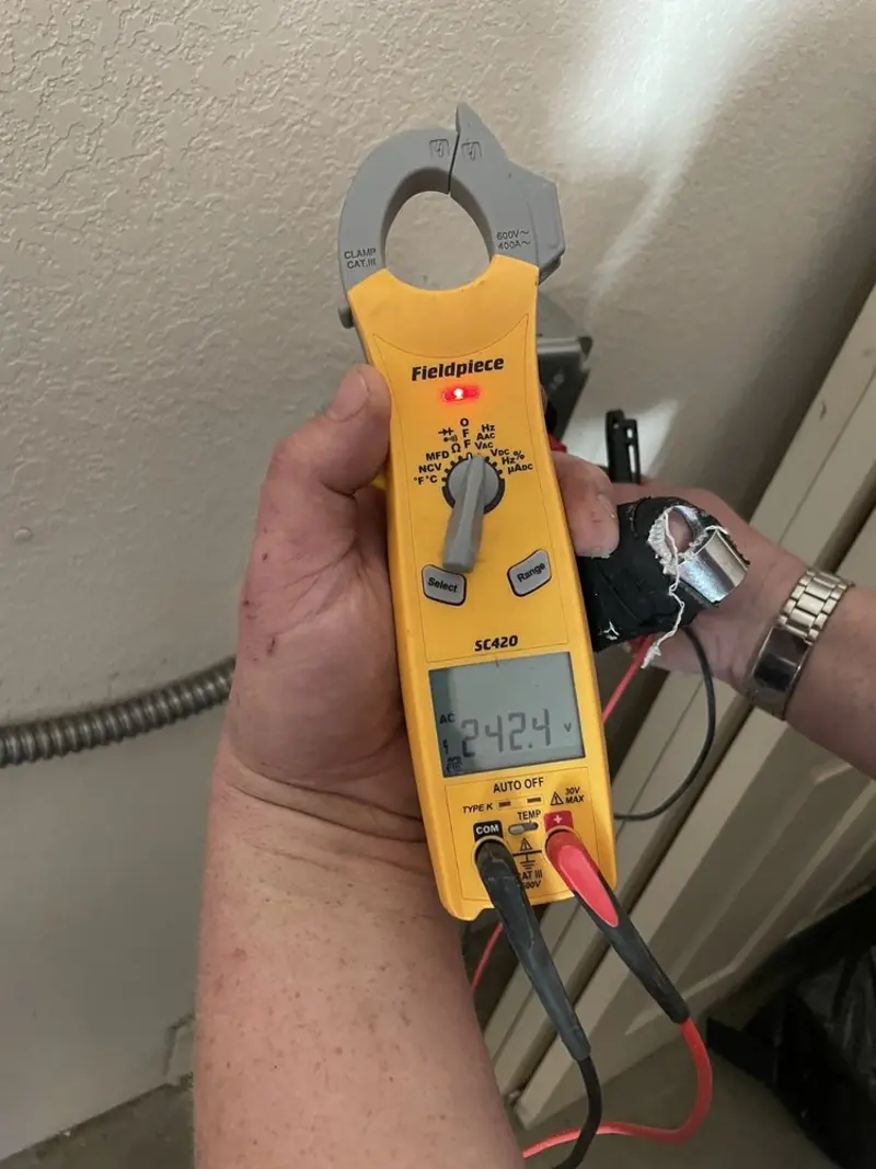 Voltage testing with clamp meter during Electrical Installation Services in Ahoskie